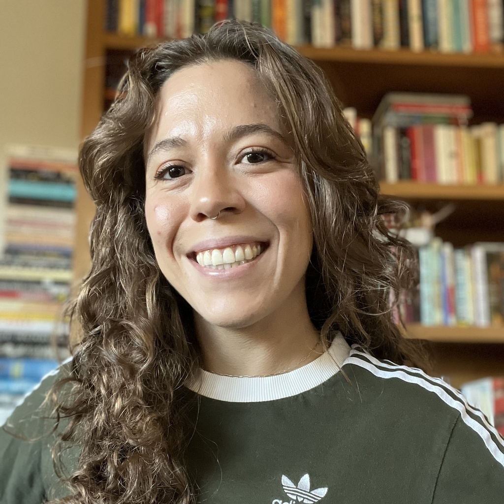 portrait photo of a woman with long curly hair
